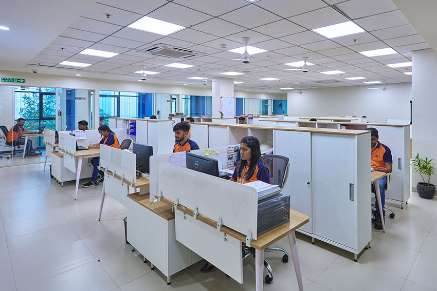 Employees working at Burakia group balaji formalin office on a desk