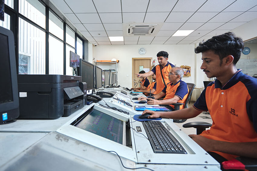 Eamployees working on computers at balaji formalin office