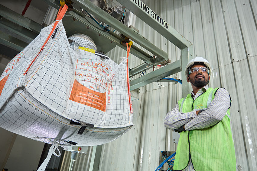 Worker is standing near hanging paraformaldehyde orange bag