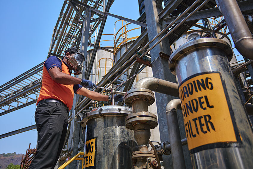 The plant operator wearing an oxygen mask is testing the paraformaldehyde  tanks